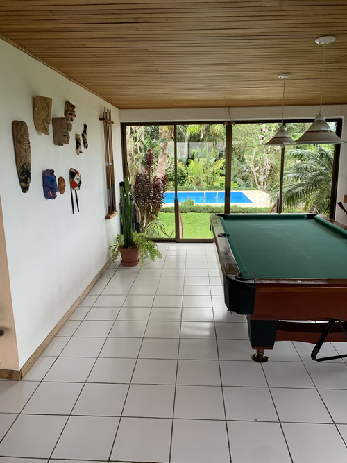 L shaped Sun Room Pool table and Pool view