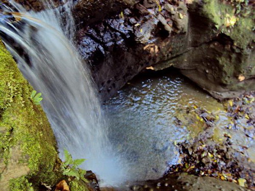 Cascading into pool below